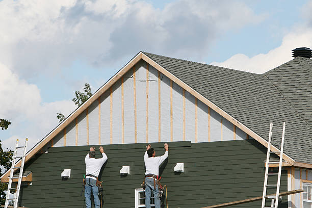 Professional Storm Damage Siding Repair technician working in Blanchester, OH